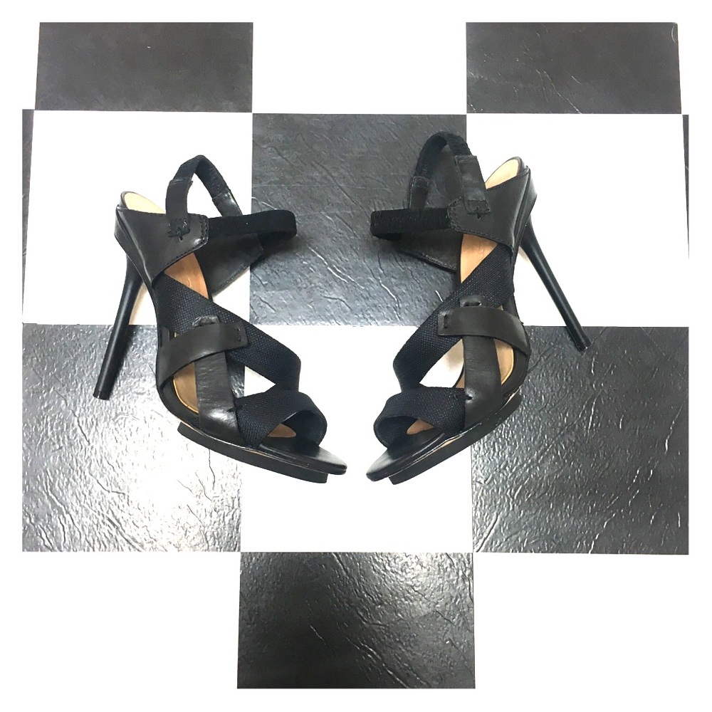 L.A.M.B. Black leather stiletto heel.